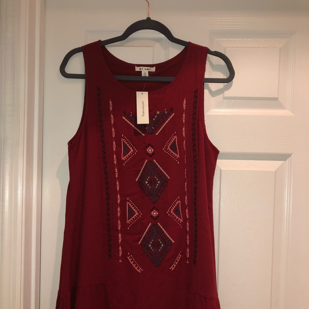 Francesca’s short, brick- colored dress